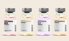 Vitamin injection glass bottles on beige background.jpg