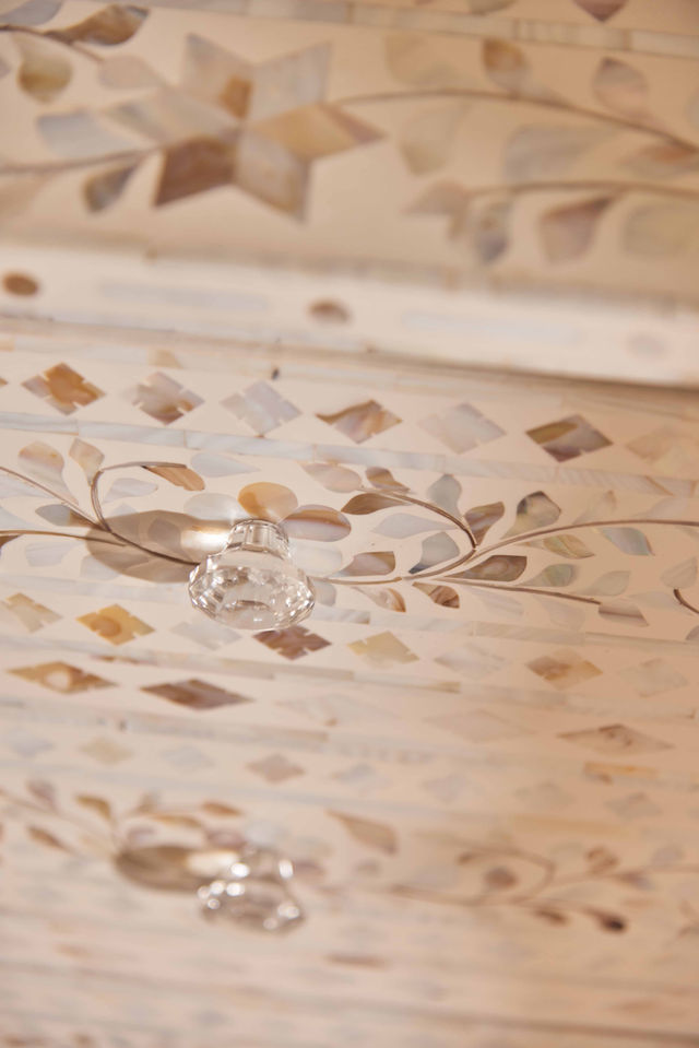 Close-up of ornate ceiling detail with embedded lights