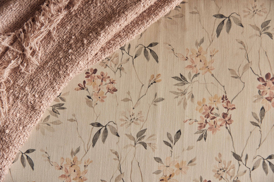 Dusty rose fabric on floral wallpaper