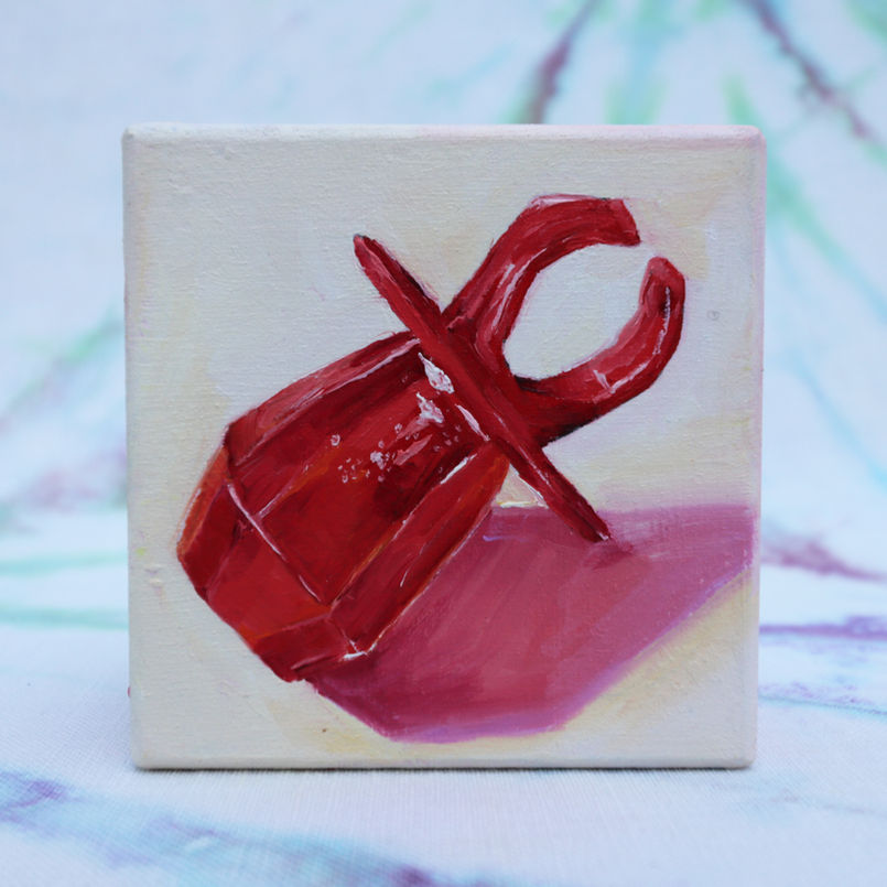 red ring pop painted on a wooden block