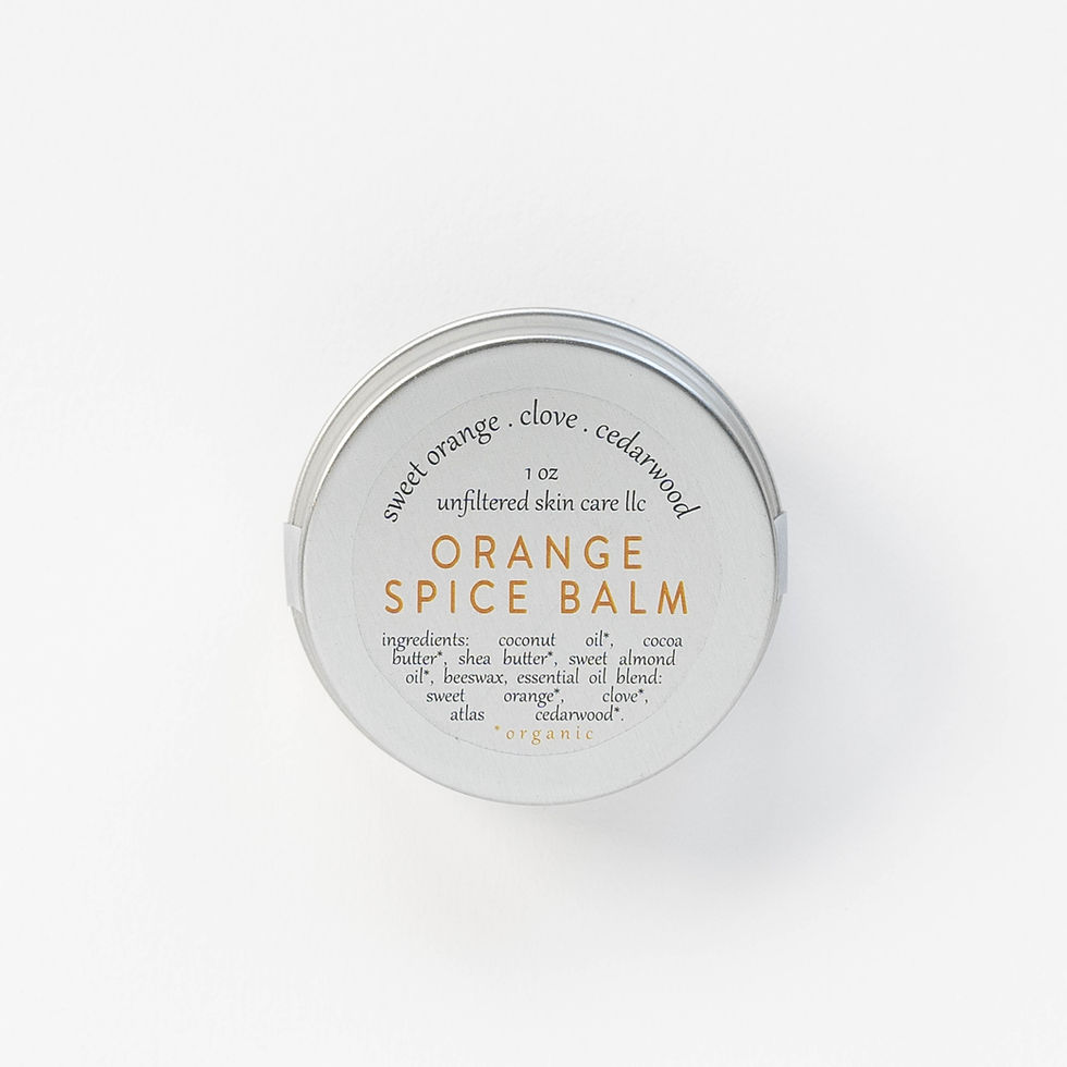Thumbnail: one ounce metal tin of orange spice body balm with clear label. on white background
