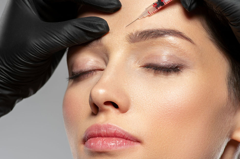 Administering Botox in Dunedin — anti-wrinkle injection to a patient's forehead in a clinical treatment room.