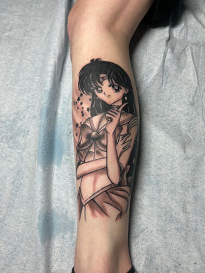 Sailor Moon Tattoo on the leg of a half sleeve. Black ink, tattoo artist located near Providence, RI