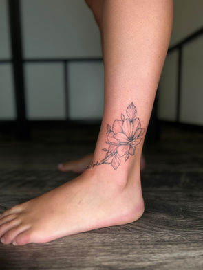 Flower Tattoo on the ankle with black ink. Rhode Island tattooer