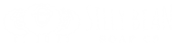 Charming logo: Three fluffy sheep in a white outline, with one sheep in the front and two behind it. The sheep on the right w