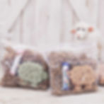 Clear bag with crinkle paper, sheep shaped soap and a lip balm