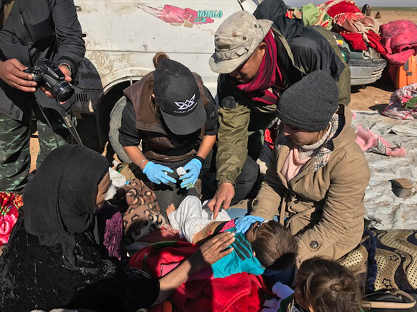 Eliya and team treat a child shot in the stomach.