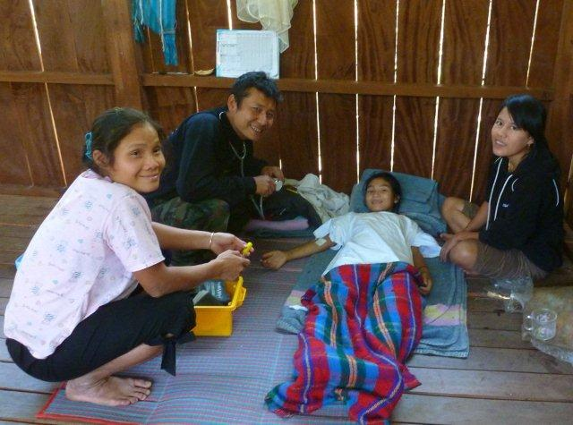 Medics caring for young girl after surgery