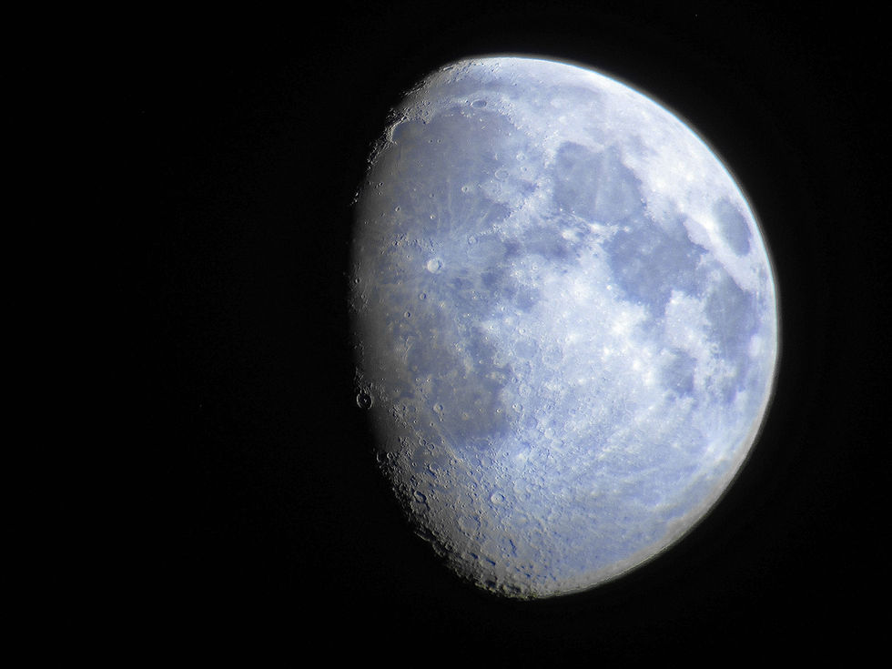 The Moon taken with a Canon point and shoot camera through a pair of Orion 20x80 binoculars from Orion Telescopes and Binoculars. Image taken in Las Vegas, NV