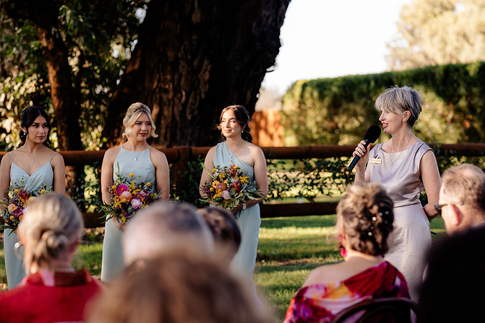Bridal party and celebrant