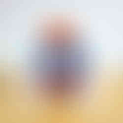 Autumn greeting card with bunny popping out of pumpkin