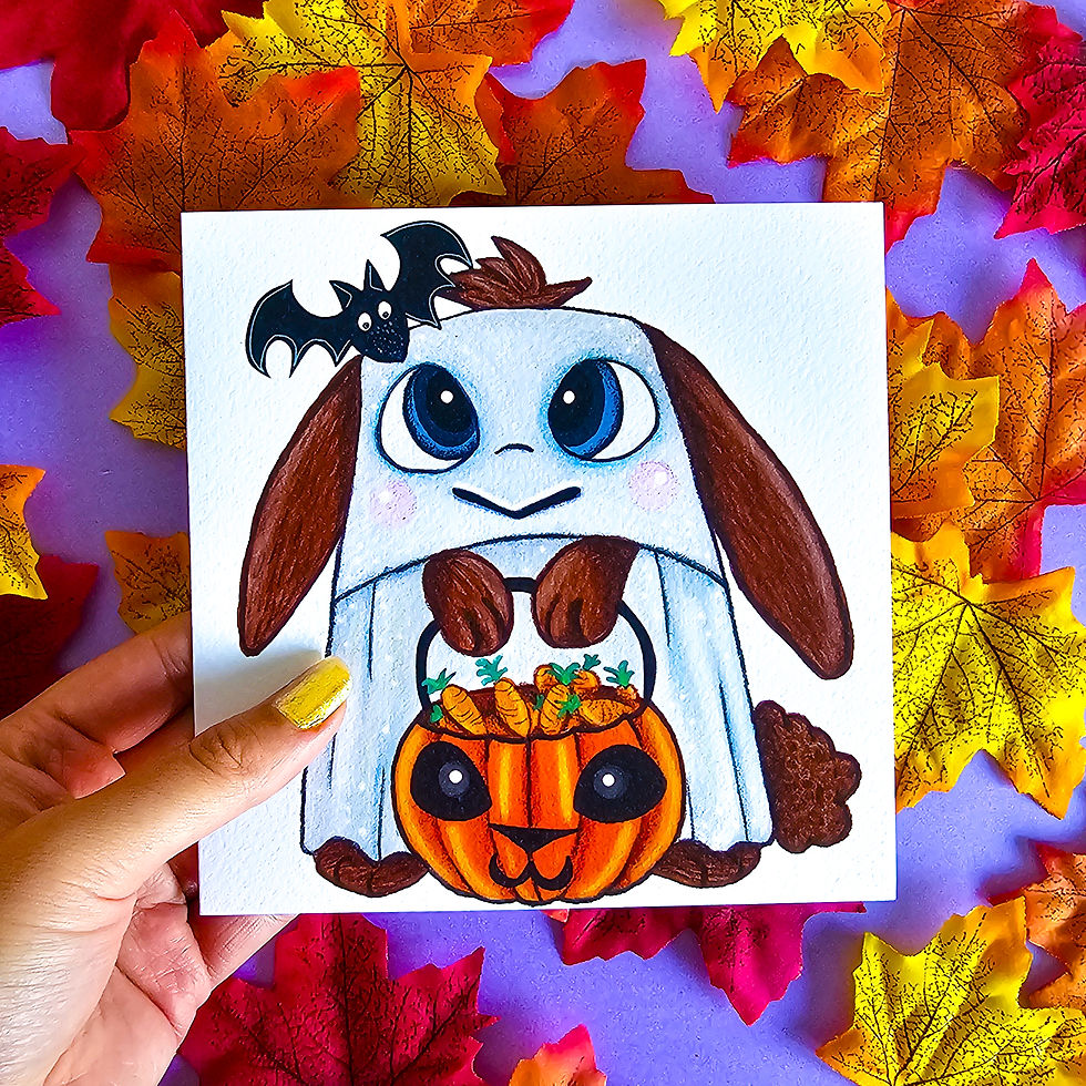 Close-up of ghost bunny with pumpkin illustration on greeting card
