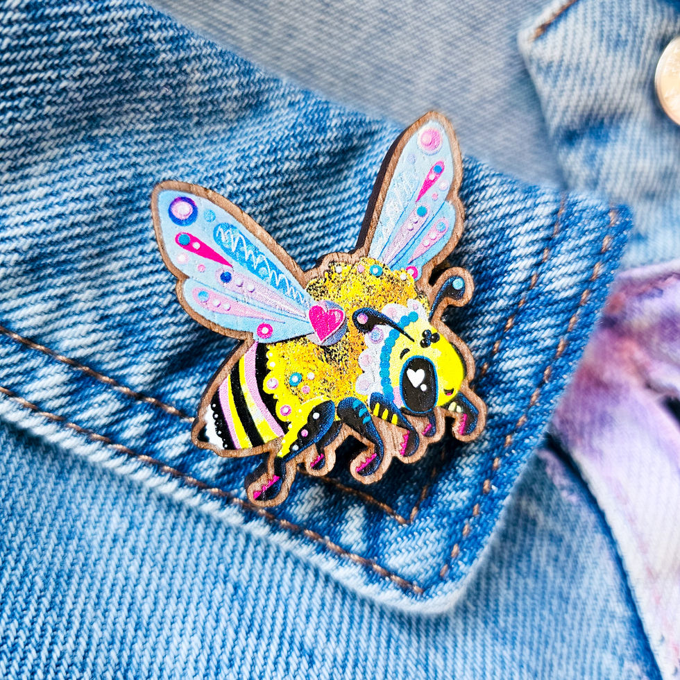 Wooden bee eco pin with star backing on sustainably sourced walnut-veneered MDF, front view