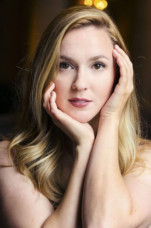 Headshot (with hands).jpg