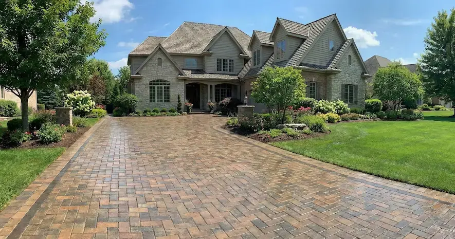 Semi-gloss sealed brick paver driveway at a Naperville IL home, highlighting restored color, clean j