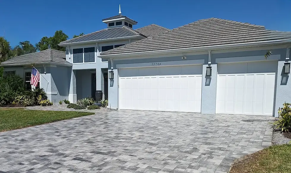Gloss-finish brick paver driveway after professional sealing at a Lake Forest IL home, showing enhan