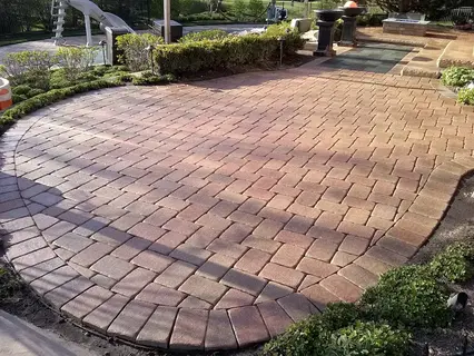 Brick paver patio sealed with a wet look, water-based sealant with a semi-gloss finish.