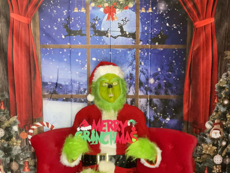 Creating Memorable Moments: Hiring a Grinch-Themed Photo Booth Rental Company