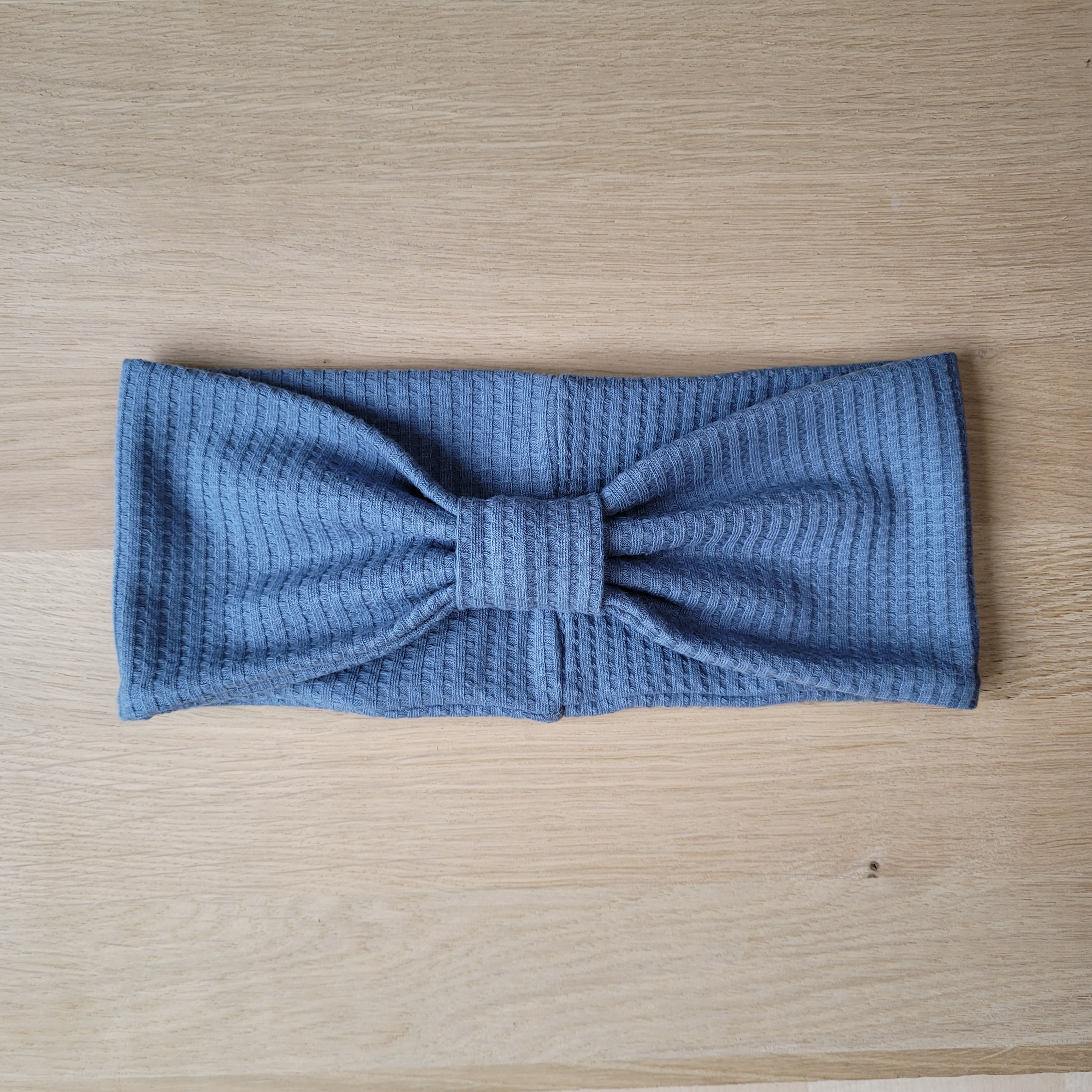 Knopfstirnband blau