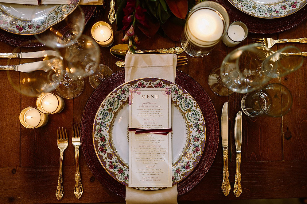 Wedding tablescape with menu card and ornate painted plate