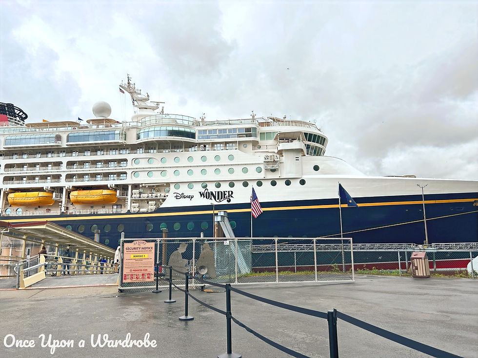 Disney Wonder cruise ship docked in Juneau, Alaska, ready for passengers to explore the port city.