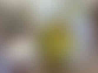 Key Lime Dole Whip soft serve in a cup topped with seasoning at Disney’s Vero Beach Resort enjoyed at an outdoor table near the beach