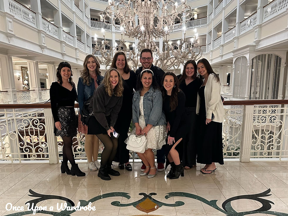 Disney bachelorette party group posing together inside the Grand Floridian lobby