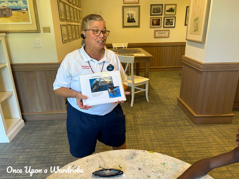 Kids craft activity at Disney’s Vero Beach Resort featuring turtle crafts, coloring supplies, and a cast member leading a family activity