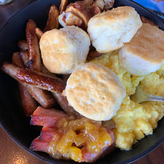 Ohana Character Breakfast- breakfast skillet with pork sausage and hawaiin bread