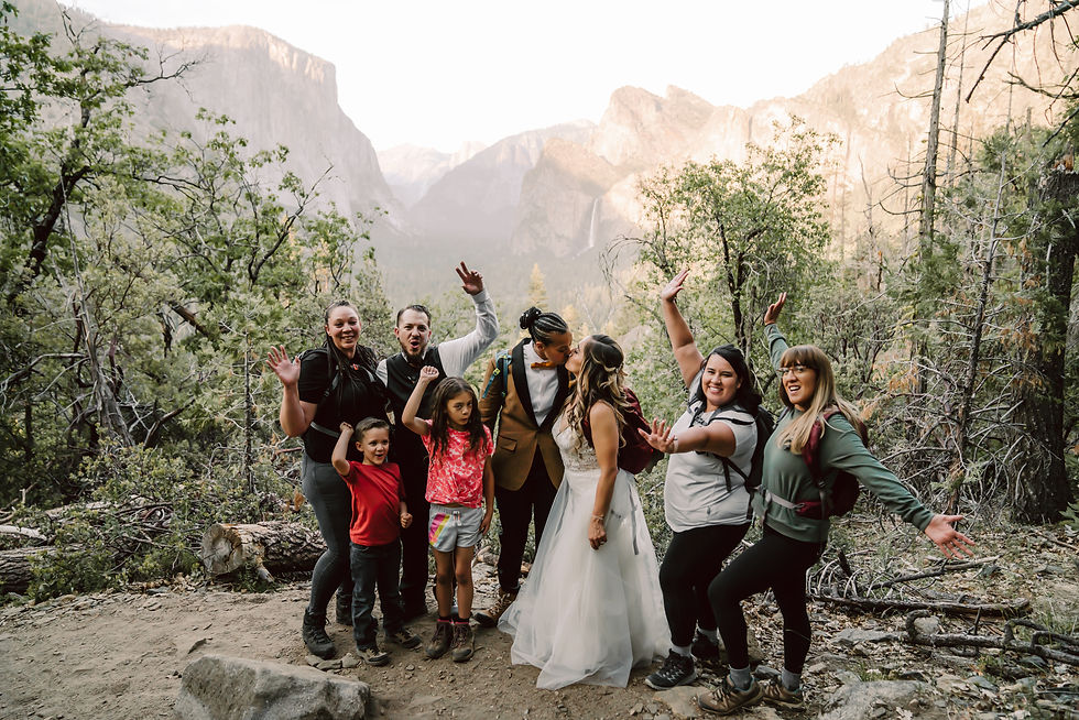 A eloping couple on a hike in Yosemite with their friends and family on their elopement day