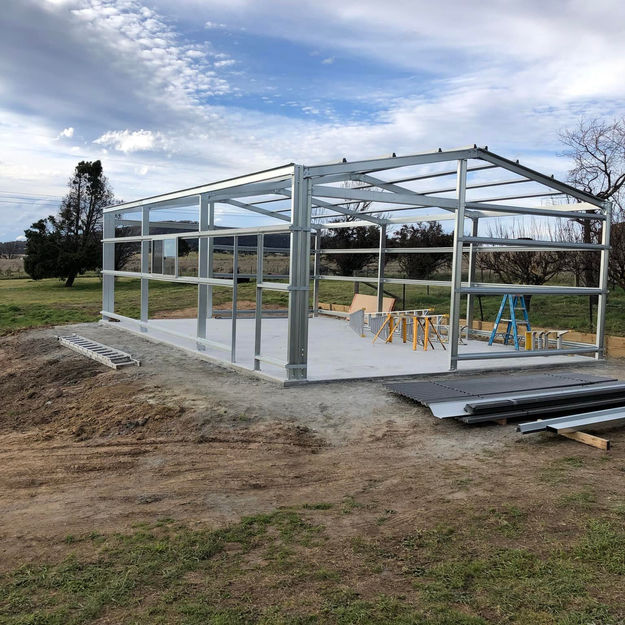 Metal garage frame under construction