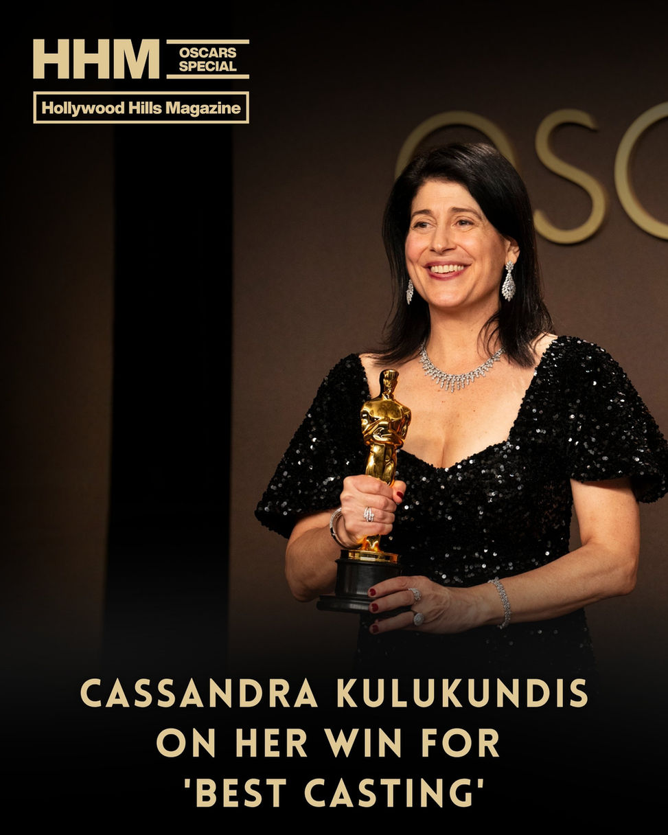 Cassandra Kulukundis in a black sequin dress smiles holding an Oscar. Background shows "Oscars Special" Text: "Cassandra Kulukundis on her win for 'Best Casting'."