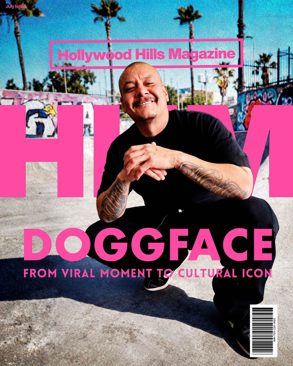 Doggface smiles on Hollywood Hills Magazine July issue cover, crouching in black shirt before palm trees and pink title text. Cover Art Design by Avi Wiseman