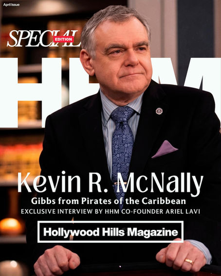 Kevin R. McNally in suit and tie on Hollywood Hills Magazine cover. Text highlights exclusive interview, Special Edition. Kevin R. McNally: Gibbs from Pirates of the Caribbean. Background features blurred shelves. Mood is formal and serious. Cover design Avi Wiseman
