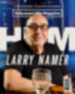 Magazine cover of Larry Namer smiling in glasses at a table, with Hollywood Hills Magazine and July Issue text. Cover Art Design by Avi Wiseman