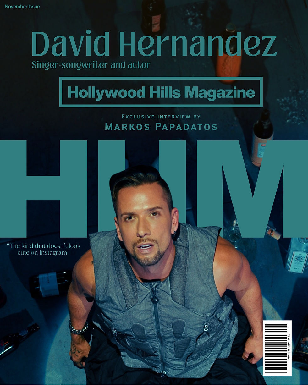 Magazine cover showing David Hernandez, in a gray vest surrounded by bottles. Text: David Hernandez: Singer-songwriter and actor "Hollywood Hills Magazine," "Exclusive Interview" with Markos Papadatos. Photography: Jen Rosenstein. cover design by Avi Wiseman