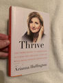 Thrive by Arianna Huffington book cover on textured blanket background