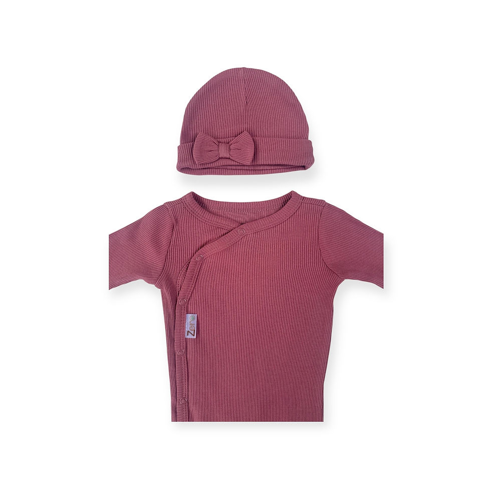 Thumbnail: Rose coloured ribbed sleepsuit with matching hat, with a small bow on.