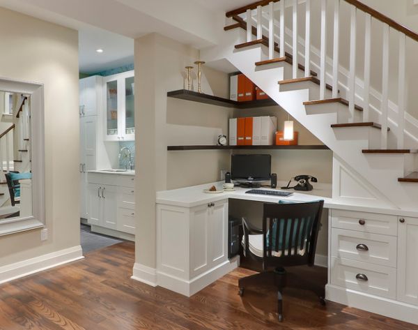 A comfortable office utilizing formerly dead space under the stairs.
