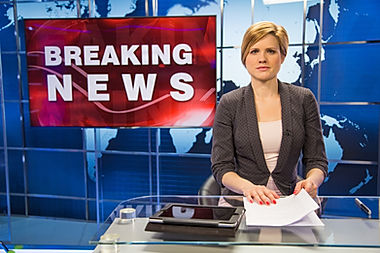 Newsreader-in-television-studio-69404107