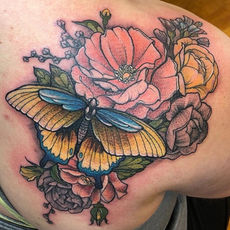 colorful tattoo of florals and a butterfly