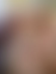 family posing in the nursery with their new baby