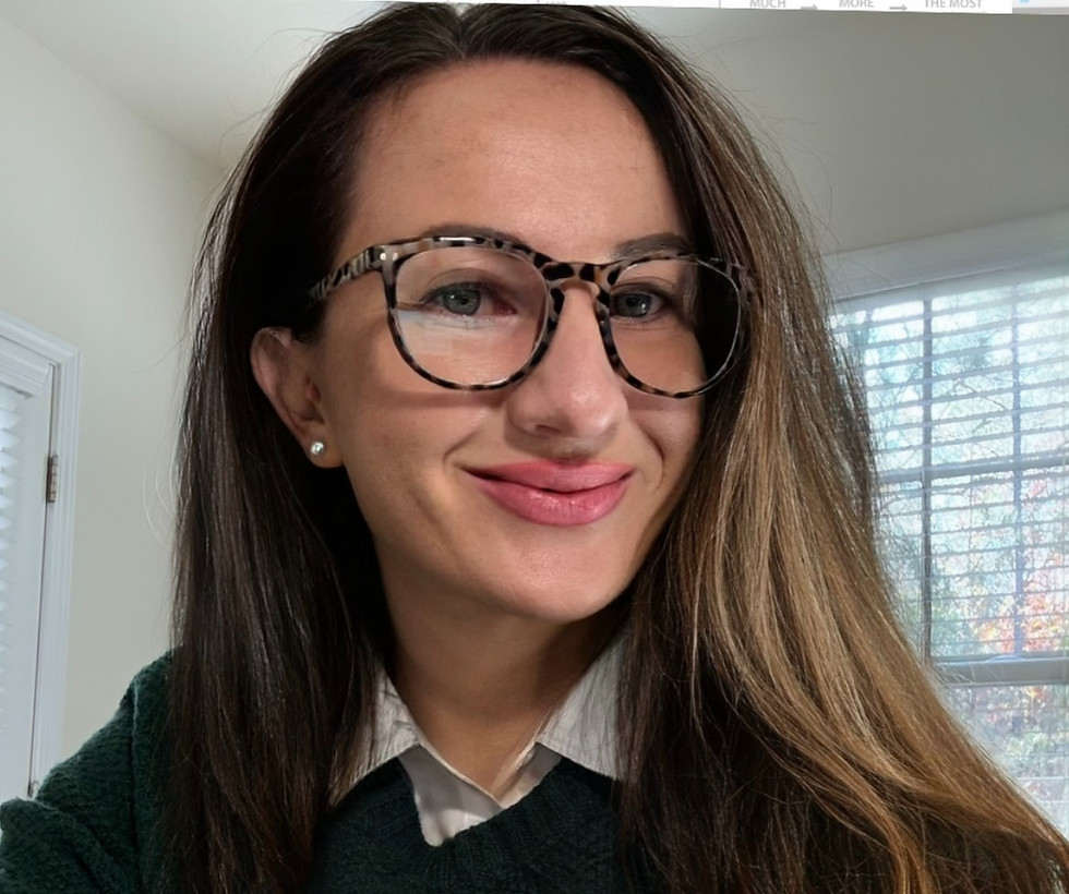 English Teacher Claire smiling in glasses
