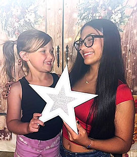 Daughters holding Santa's Star