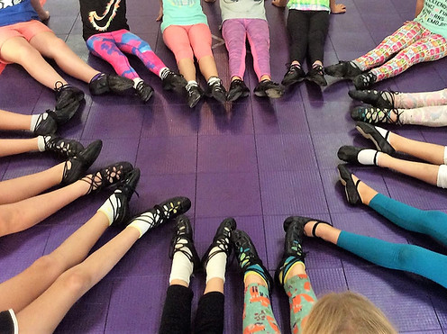 Feet in Irish dance shoes in the shape of a heart