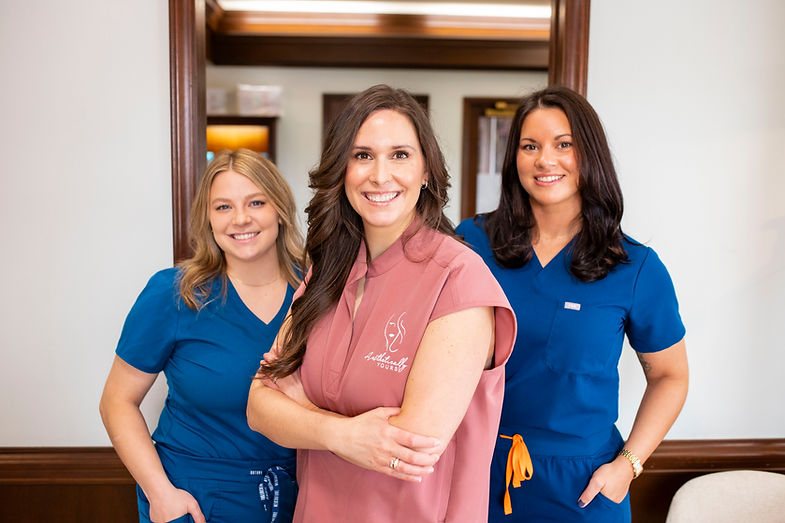 team photo of the staff at aesthetically yours