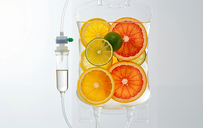 fruit in an IV bag to symbolize vitamins in an IV treatment