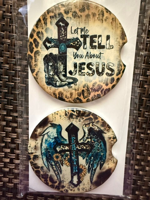 Ceramic car coasters with cross designs and leopard print.