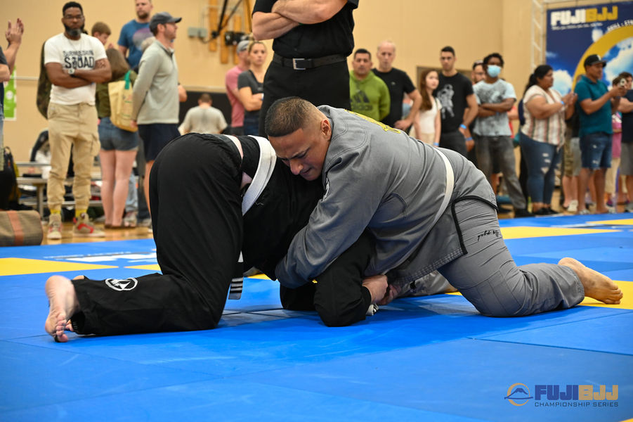 A heavyweight competitor from Pica Pau gains a dominant position during a jiu jitsu match in Chicago.