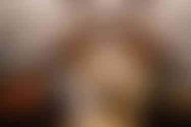 couple kissing in front of fireplace